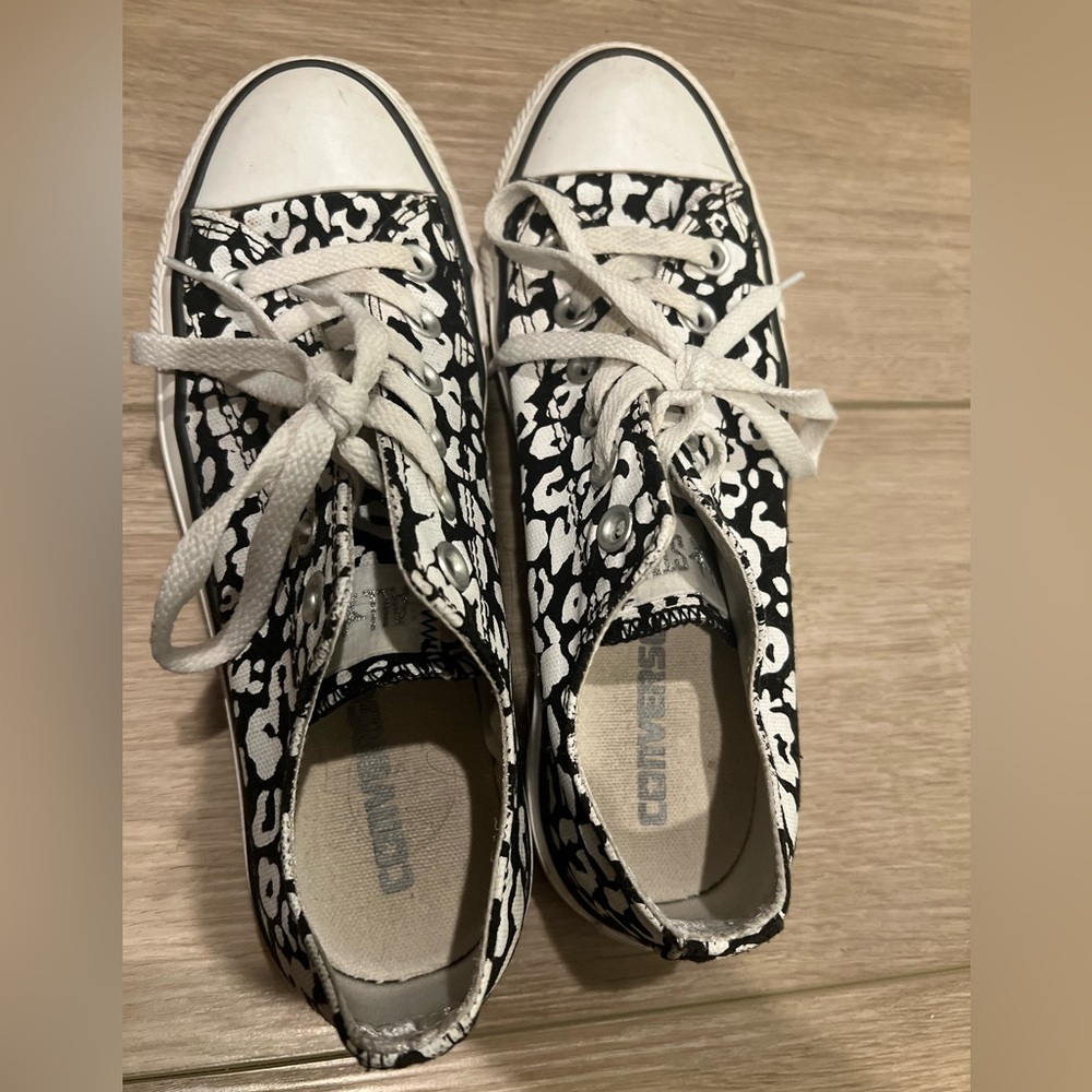 Black and white spotted converse shoes